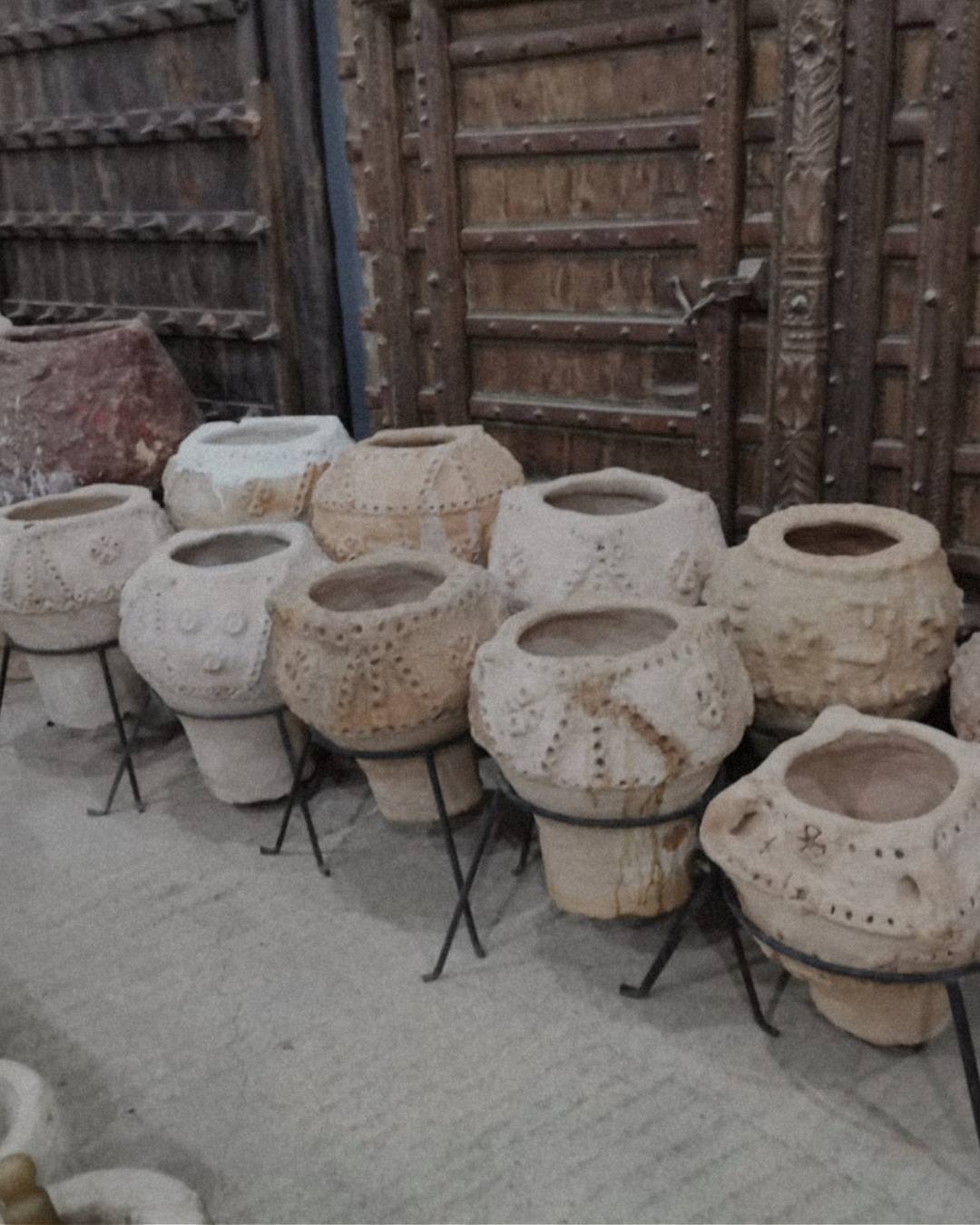 Courtyard of hand-built jars in the depot