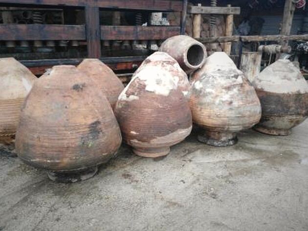 Enez Jar, Large — group of large rounded clay jars with ridged, chalky pink-brown bodies
