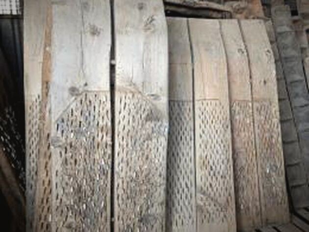 Düven Threshing Board — weathered pale wooden boards with rows of embedded flint studs