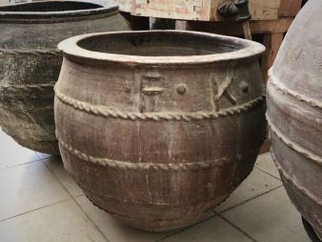 Olive Dağar Jar, I — huge round-bellied clay jar with rope-like bands and embossed marks